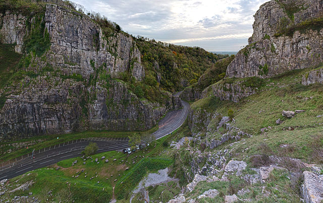 Cheddar Gorge: A road meanders between two limestone cliffs